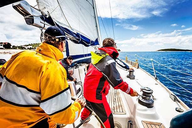 istock Sailing crew beating to windward on sailboat 170098148