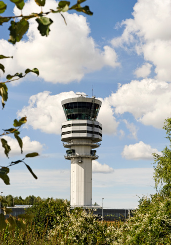 Air traffic control tower at Brussels Airport with beautiful cloudscape ,Belgium.