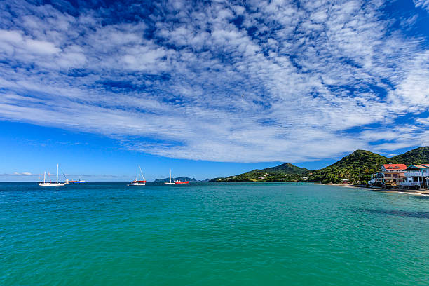 Fishing boats and yachts moored off Hillsborough Bay. Hillsborough is the largest town on Carriacou Island and is bounded by a long sandy beach that stretches the entire length of town. Grenada, W.I.