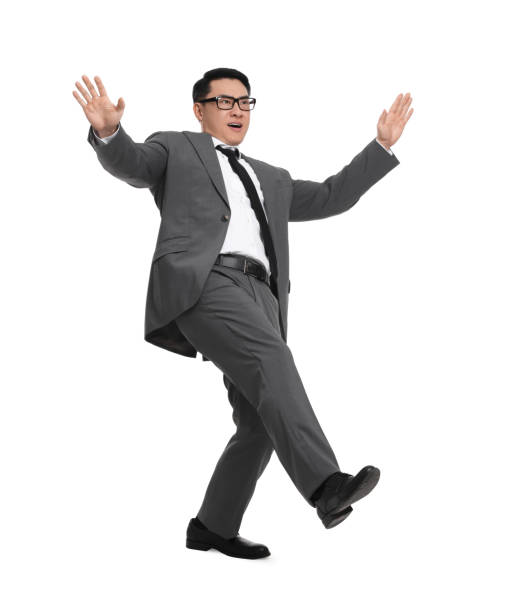 istock Businessman in suit posing on white background 1700990443