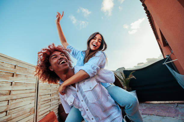istock Couple having fun on the rooftop 1700993566