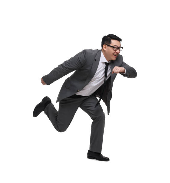 istock Businessman in suit running on white background 1700994267