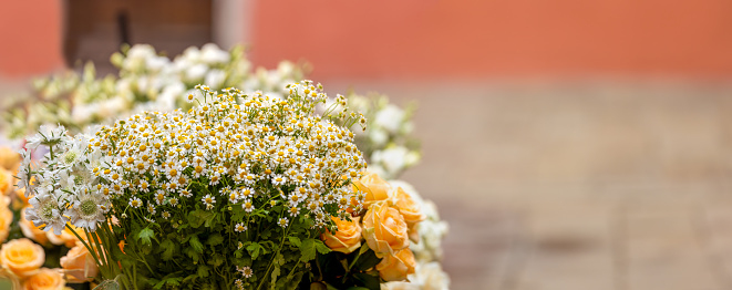 closeup banner of bouquet of orange daisies and roses, panorama, valentine day, wedding