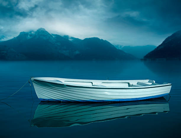 White boat on the dark lake
