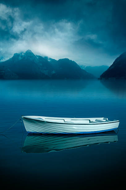 istock Boat on the dark lake 170099915