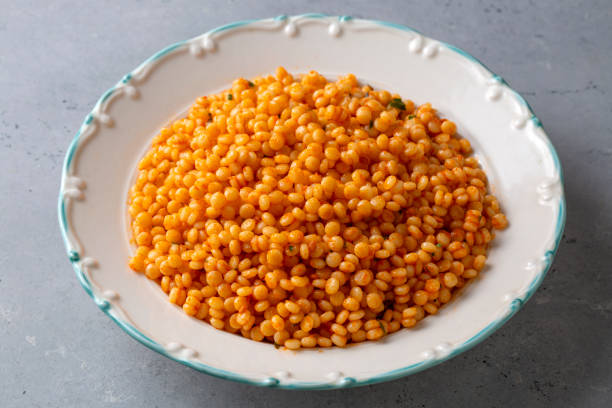 istock Couscous pilaf with tomatoes. Turkish name; domatesli kuskus pilavi 1701000257