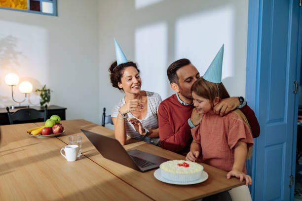 istock Father kissing his daughter while they celebrate his birthday 1701002400