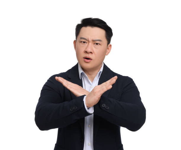 istock Angry businessman in suit posing on white background 1701005517