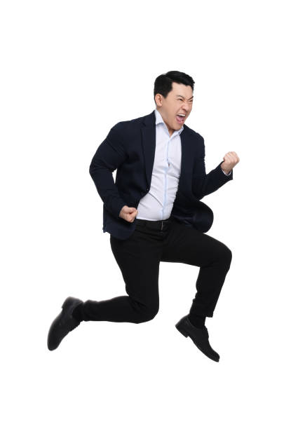 istock Businessman in suit jumping on white background 1701005524