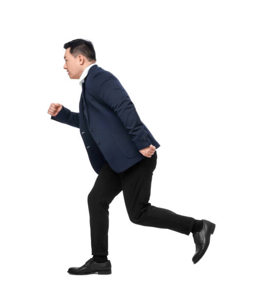 istock Businessman in suit running on white background 1701006050