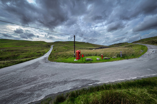 Red telephone box turned into a bookstore along the High Street, Chard, Somerset, UK, Europe.