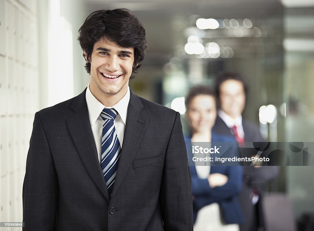 Sorridente jovem Empresário no trabalho no escritório. - Royalty-free Adulto Foto de stock