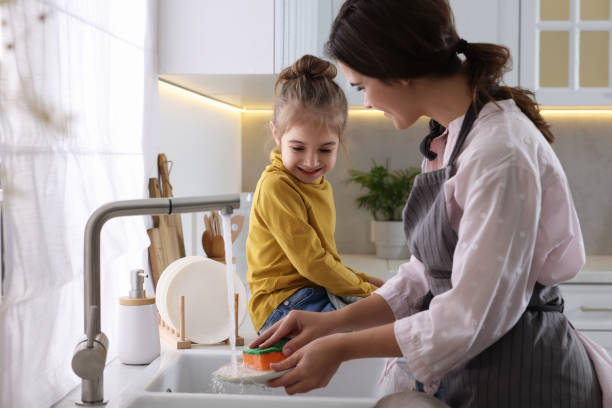 istock Young mother and her daughter spending time together in kitchen 1701017071