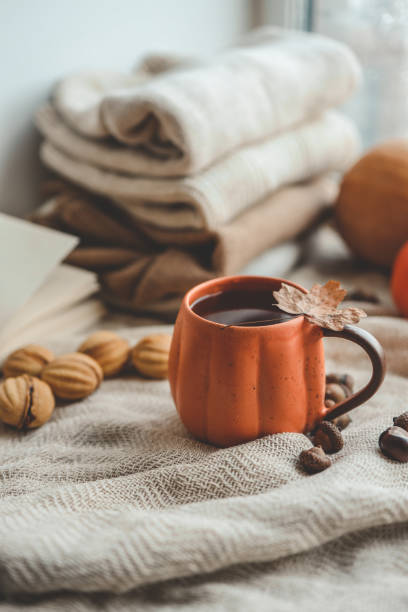 istock Cup of hot tea and a leaf, autumn mood 1701018667