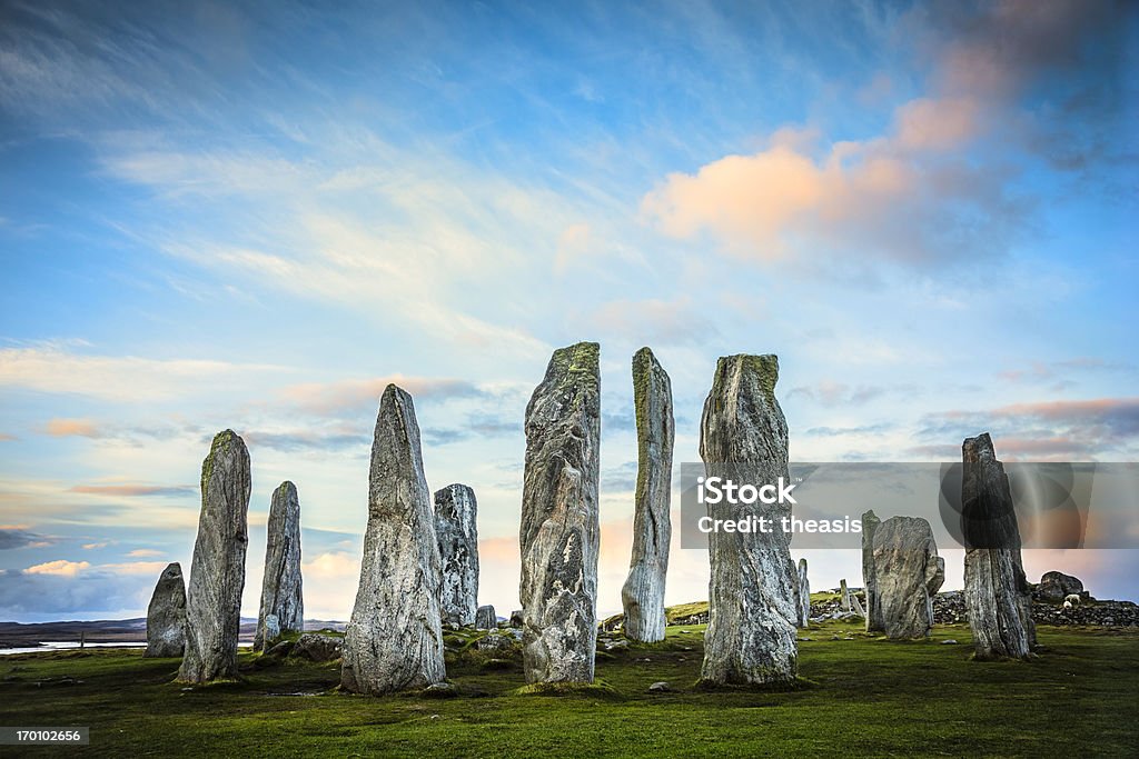 Callanish Standing Stones, Isle of Lewis The ancient standing stones of Callanish (or Calanais) on Lewis in the Outer Hebrides of Scotland at sunrise. Built about 5000 years ago, the deeply textured stones of Callanish are arranged in allignments of avenues and a central circle not unlike a celtic cross. Callanish Stock Photo