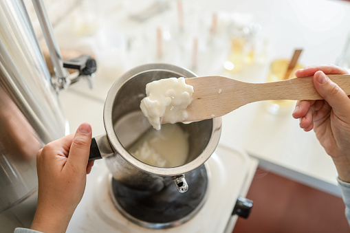 istock Soy wax melting pot, candle making process 1701031628