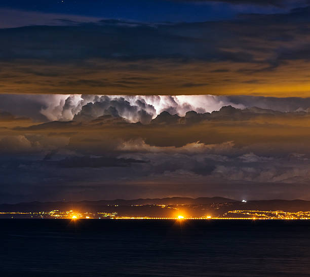 Lightning strike in distant Adriatic storm over the Italy.