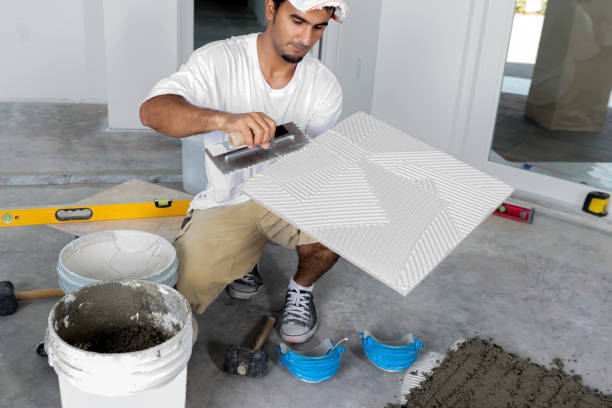 Construction: Laying a porcelain tile floor stock photo