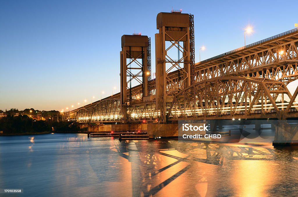 Gold Star Memorial Bridge Gold Star Memorial Bridge (I95 bridge) at twilight along with train bridge, taken from town of Groton side in Connecticut. Groton - Connecticut Stock Photo