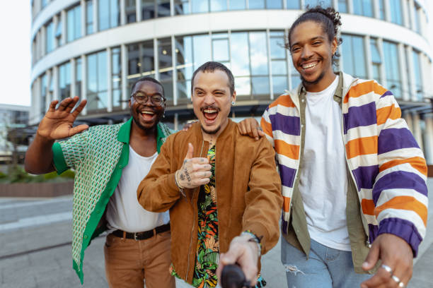 istock Male vloggers having fun making social media content 1701035911