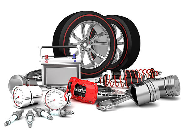 Assortment of car parts on white surface stock photo