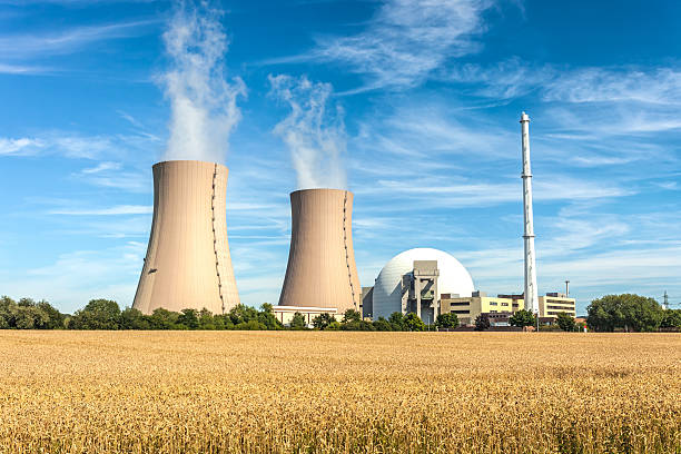 Nuclear Power Station Nuclear Power Station and wheat field nuclear energy stock pictures, royalty-free photos & images