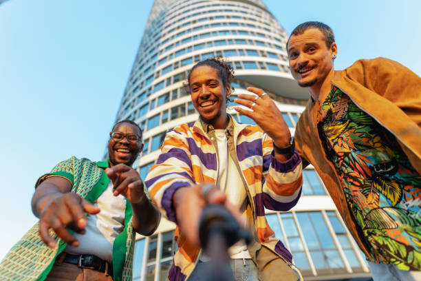 Young cool male influencers filming video