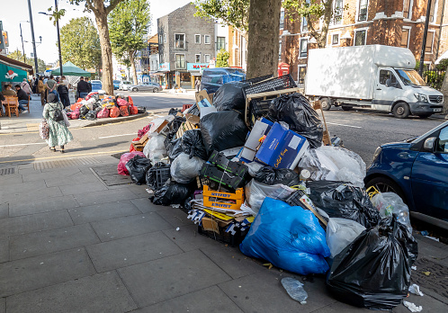 London. UK- 09.23.2023. Large piles of garbage left uncollected on the street due to industrial strike action by refuse workers.