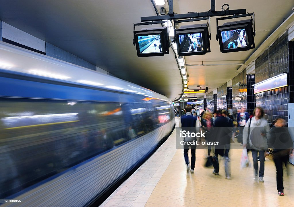 Underground station Slussen Underground station Slussen and its supervion CCTV monitors. Motion blurred train departs from the platform, motion blurred parrengers walking. Surveillance Stock Photo