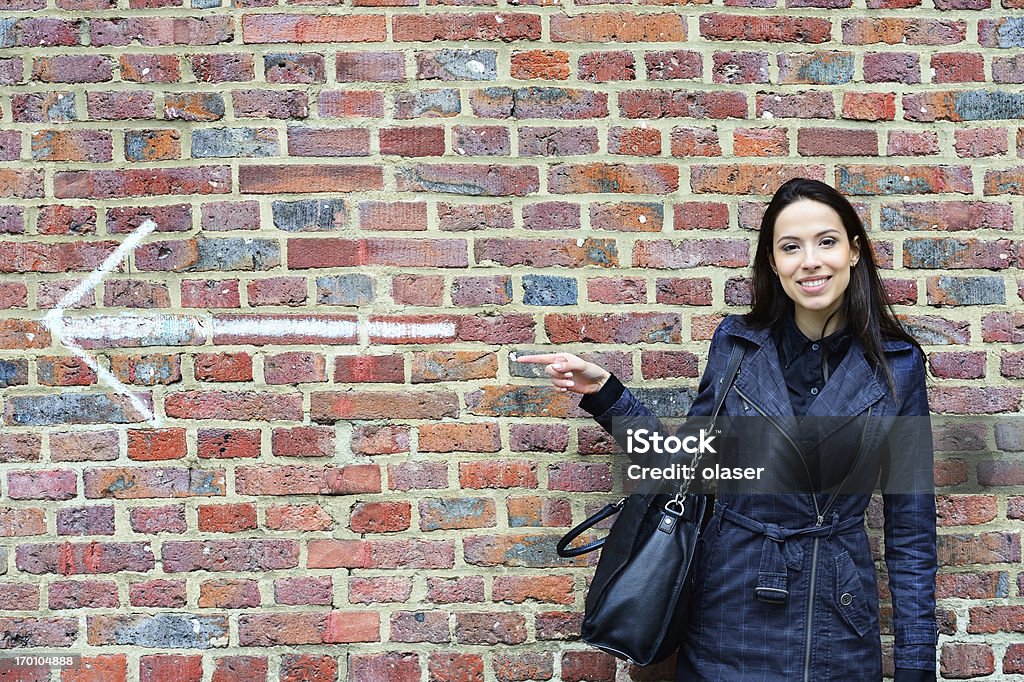 Woman pointing  forward Strong woman looking pointing ahead. Pointing Stock Photo