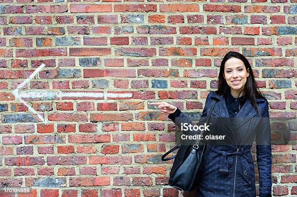 Woman Pointing Forward Stock Photo - Download Image Now - Pointing, Profile View, Symbol