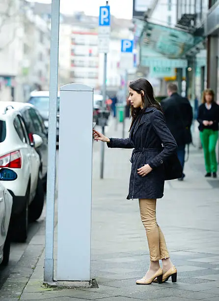 Photo of Woman and parking meter