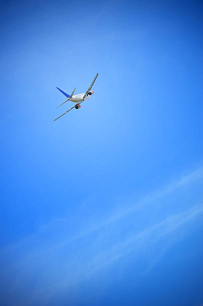 istock Sunlit airplane taking off against blue sky 170104997