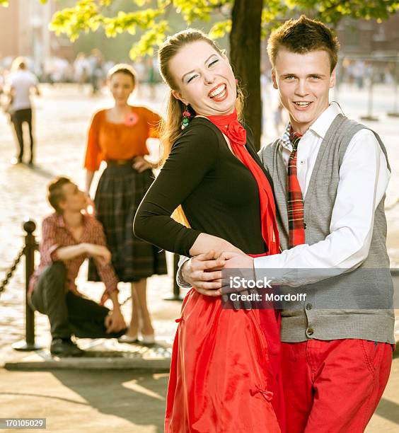 Smiling Retro Couple Outdoors Stock Photo - Download Image Now - 1950-1959, Fashion, 20-29 Years