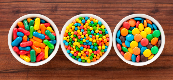 Three bowls with varieties of candies