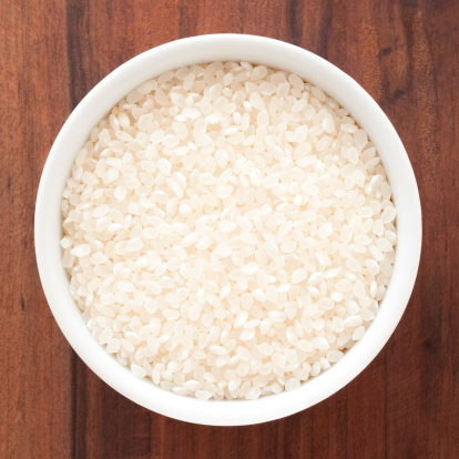 Top view of white bowl full of sushi rice