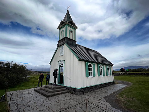 July 14, 2023 - ÞINGVELLIR NATIONAL Park,  Iceland.  Travelers visit this a small church, called by its anglicized name, “Thingvellier,”.  This location was where the Althing parliamentary general assembly met between 930 and 1798. It has also been home to a church for over 1,000 years.