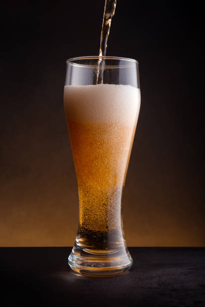 istock Fresh cold beer pouring into glass 1701059079