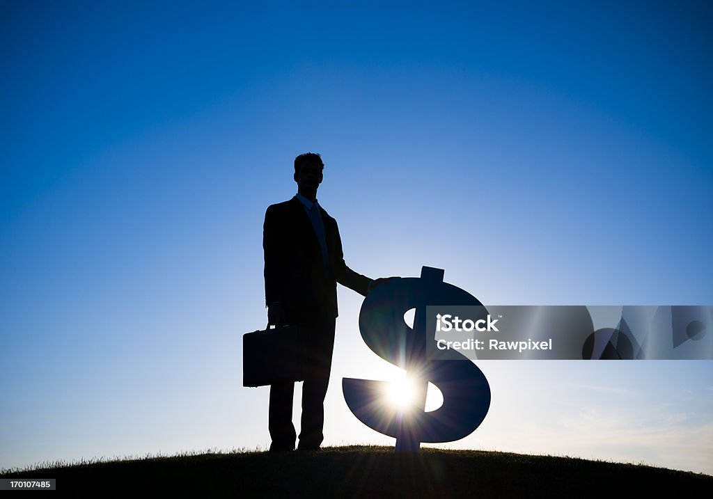 Businessman with Dollar currency sign  Achievement Stock Photo