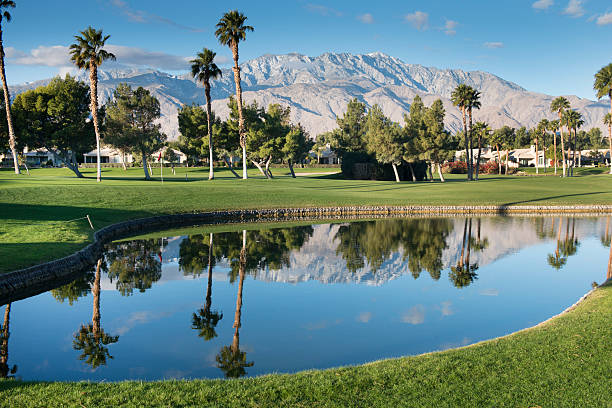 Palm Springs Golf Course The San Jacinto Mountains reflect off the water on a Palm Springs California golf course. country club stock pictures, royalty-free photos & images