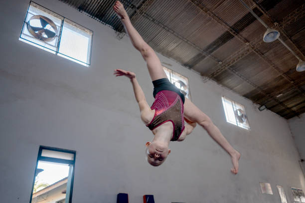 little girls practice artistic gymnastics