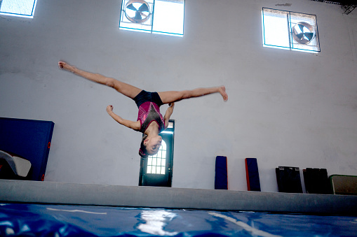 little girls practice artistic gymnastics