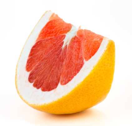 Slices of lemon, grapefruit and orange assorted on a plate