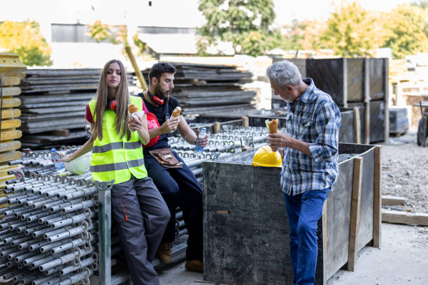 istock A Multi-Ethnic Group of Construction Workers is Taking a Break and Eating. 1701081092