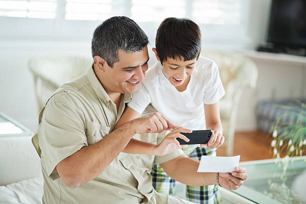 Check With People 250+ Two People Holding A Cheque Stock Photos, Pictures & Royalty-Free ...