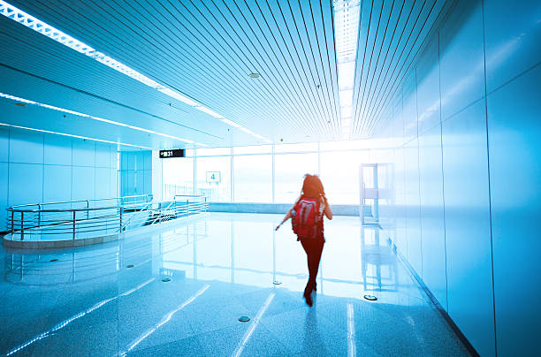 istock people walking in airport corridor with blur 170110705