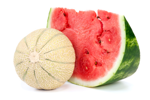 Cantaloupe and slice watermelon on white background.