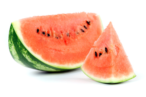 Sliced watermelon isolated on white background. Selective focus, shallow DOF.
