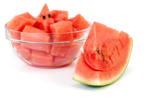 Portion of watermelon in glass bowl prepared for eating. Isolated on white background.