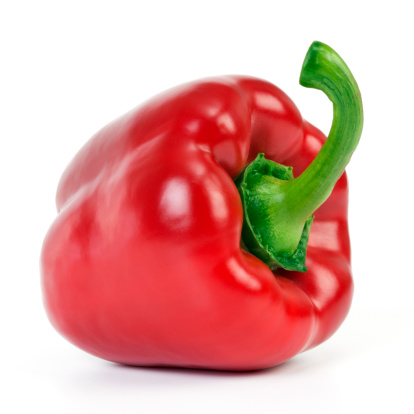 Red bell pepper is on a white background with green stem to the camera. The upper oblique illumination, isolated on white background.